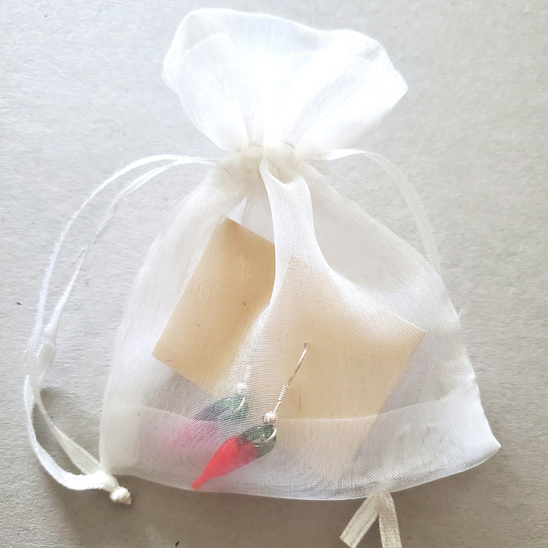 chile pepper earrings in a white organza bag
