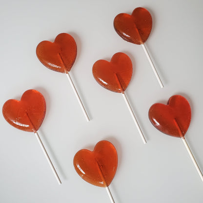 Group of heart shaped red lollipops