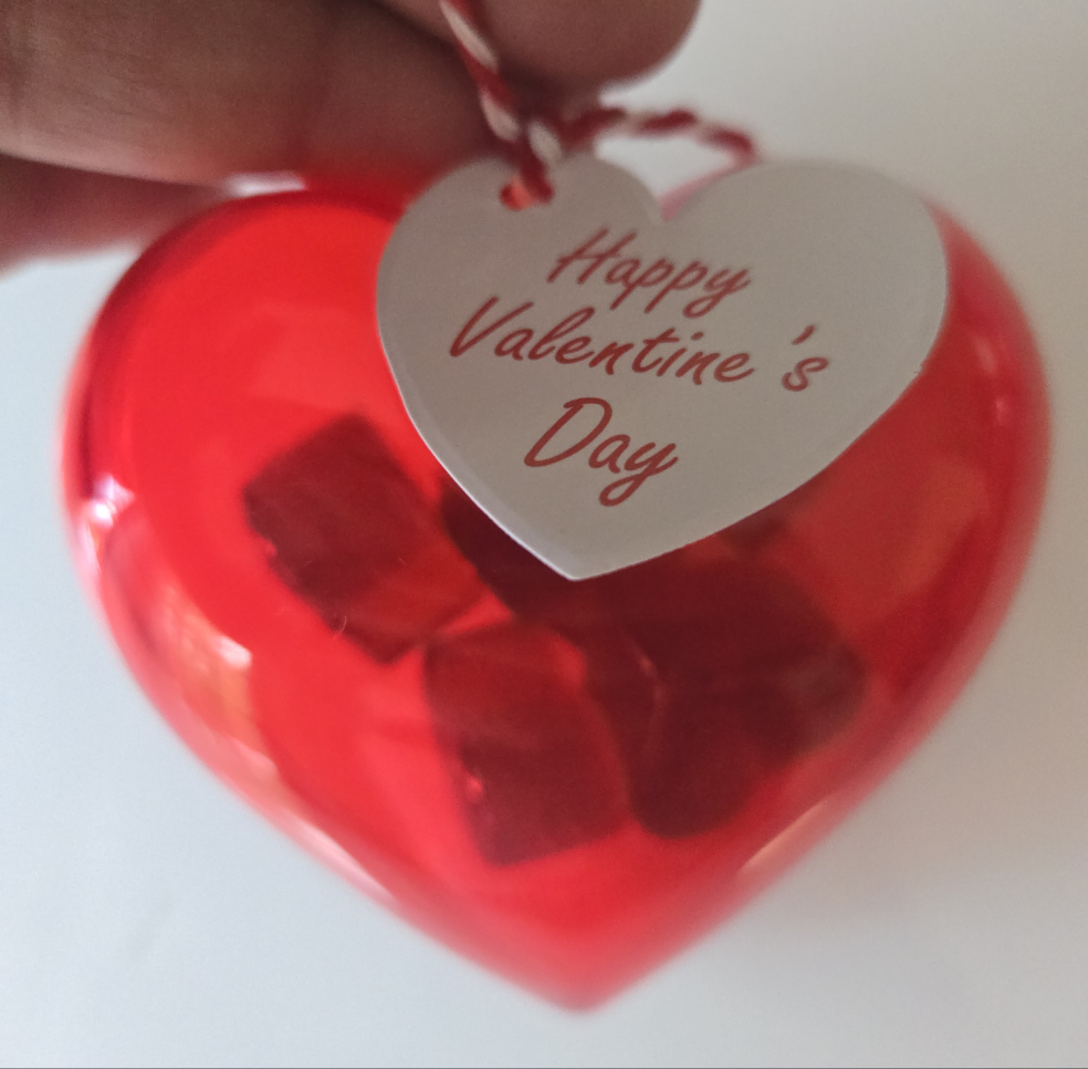 Valentine's Day candy heart filled with hot Cinnamon candy drops