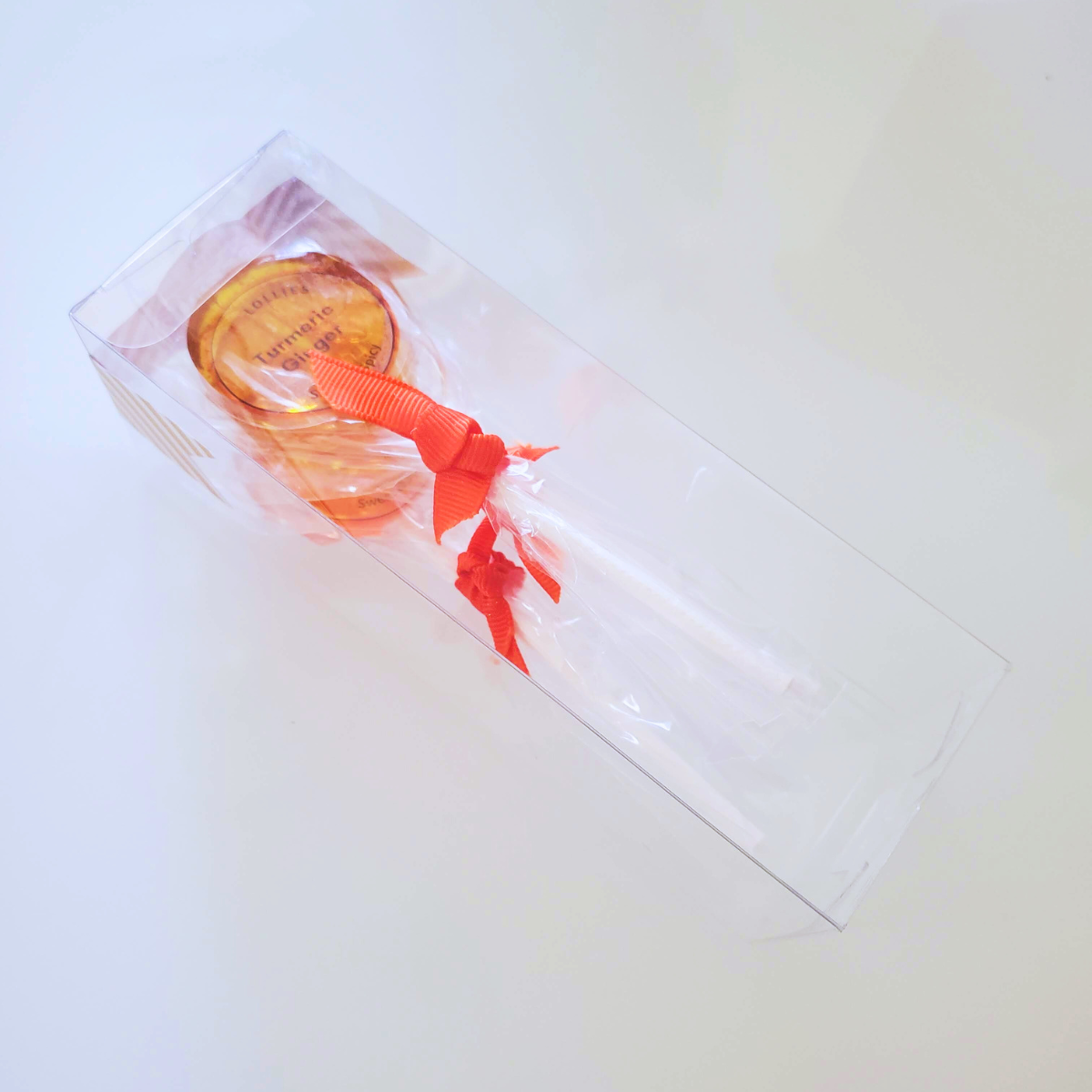 bundle of three lollipops in a clear box