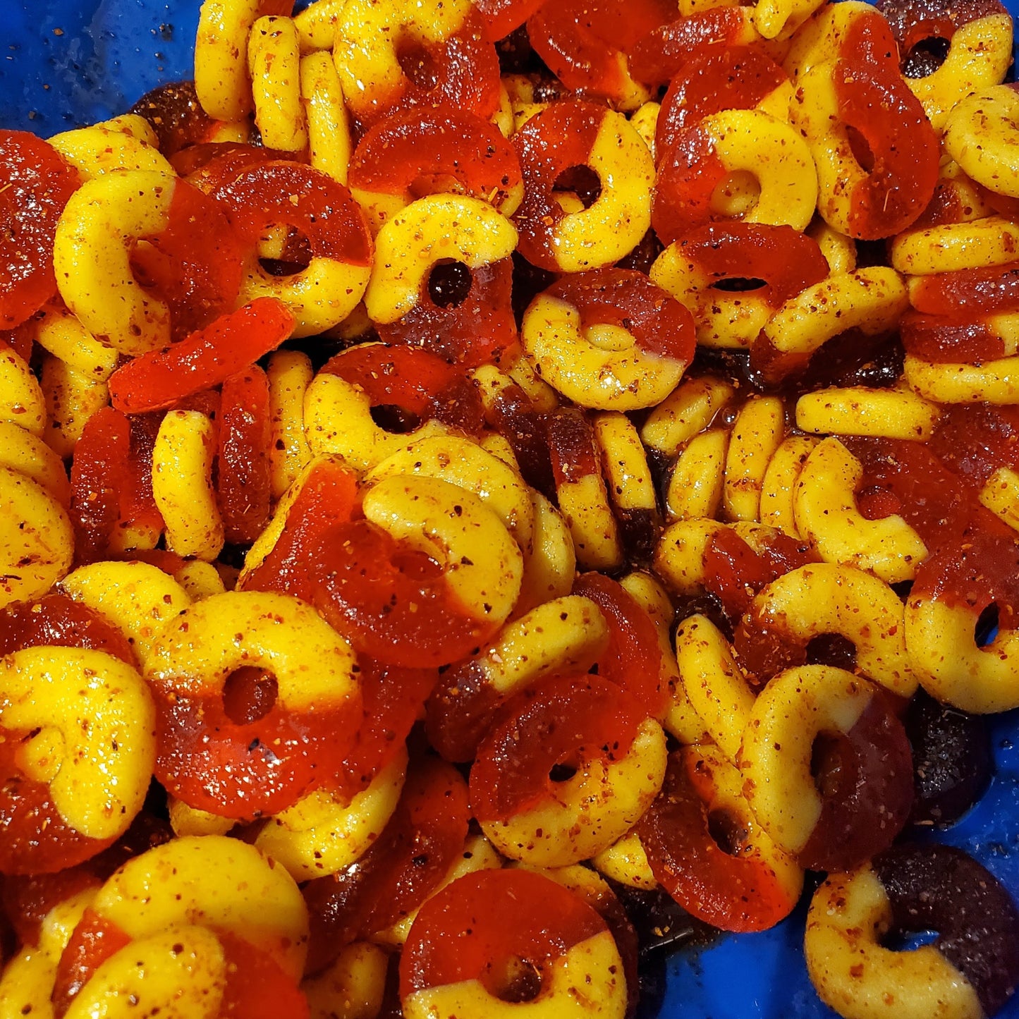 close up of spicy chamoy peach gummy rings